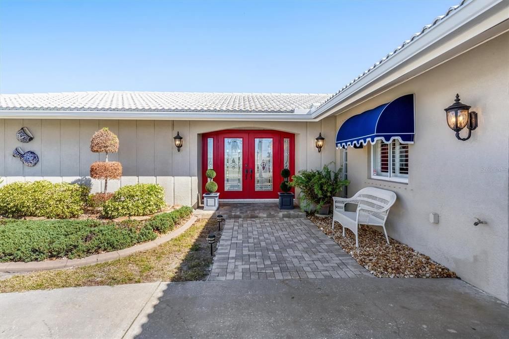 Charming pavers to entrance.  Etched glass double doors with sidelights.