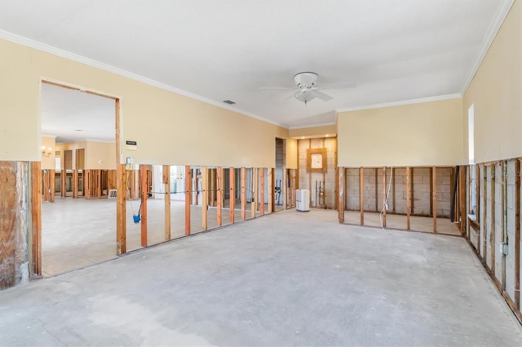 Primary bedroom looking out door opening into great room.