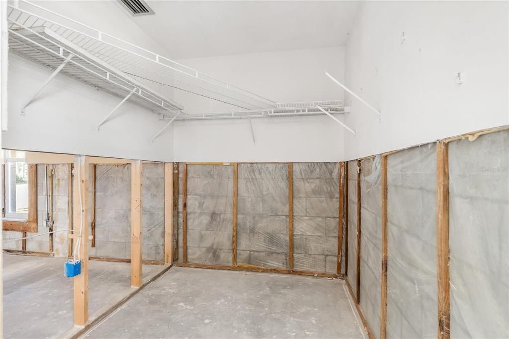 Primary bedroom walk-in closet.