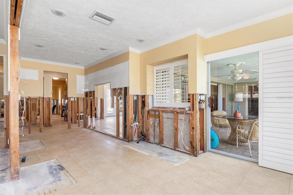 Kitchen with pass through to lanai.  Plantation door shutters