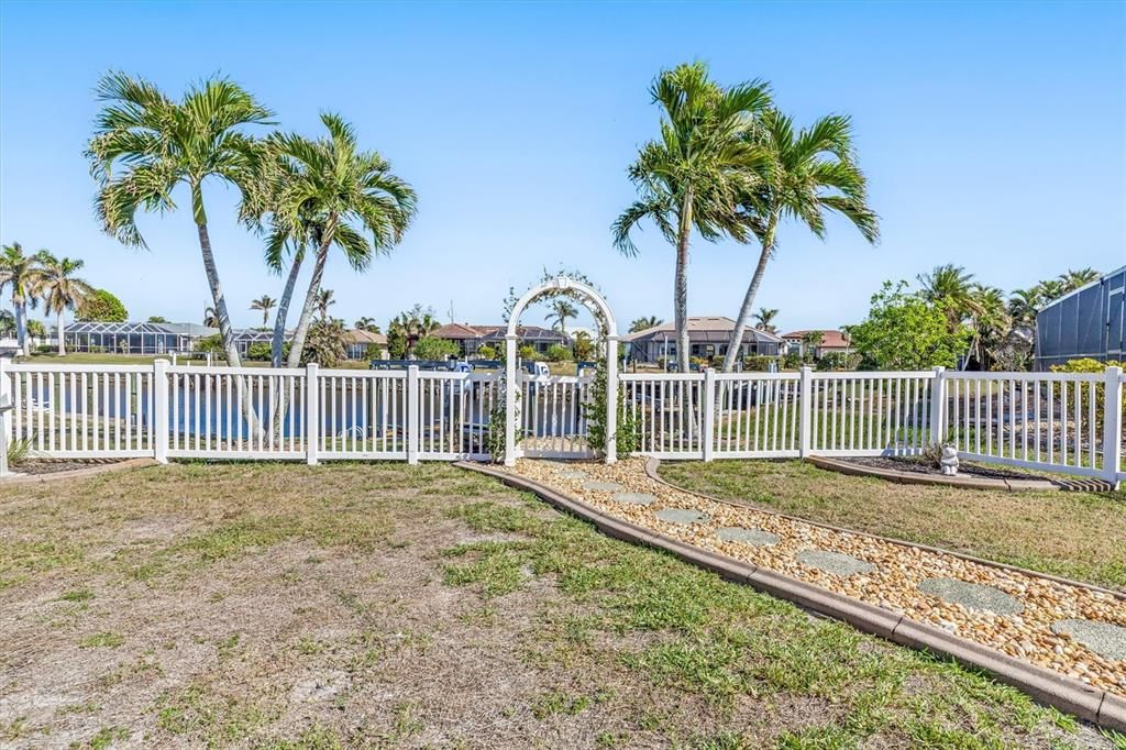 Walkway to dock and lift.  Fenced yard.