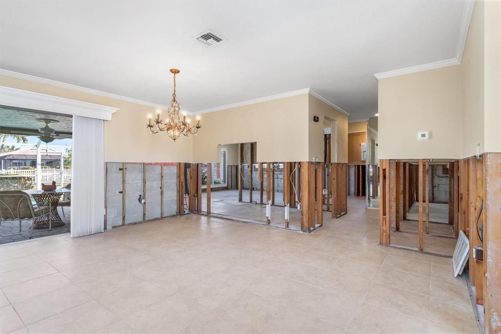 Hallway from great room to kitchen, guest bedrooms, office and laundry.