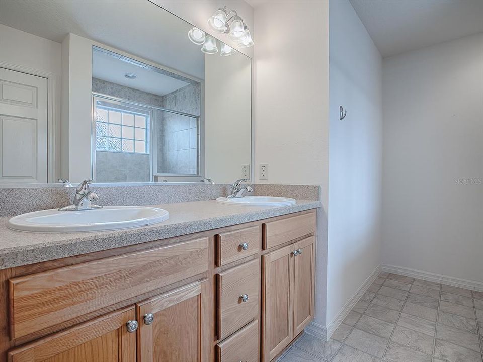 DUAL SINKS AND BEVELED EDGE LAMINATE COUNTERTOPS.