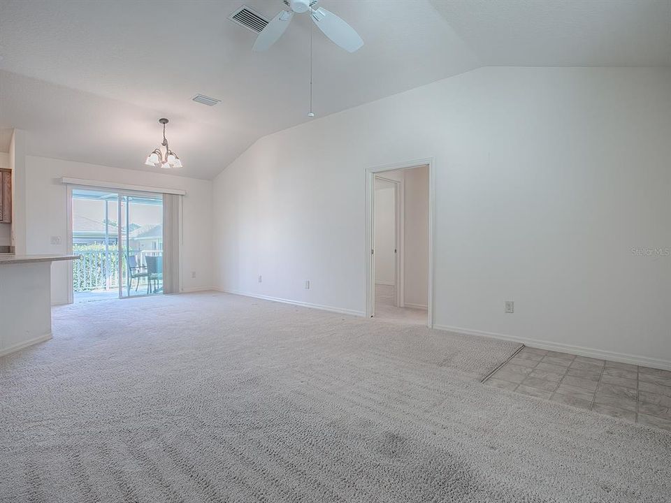 DINING ROOM IS UNDER WHERE THE LIGHT FIXTURE IS. SLIDING GLASS DOORS OPEN OUT TO THE ELEVATED LANAI.