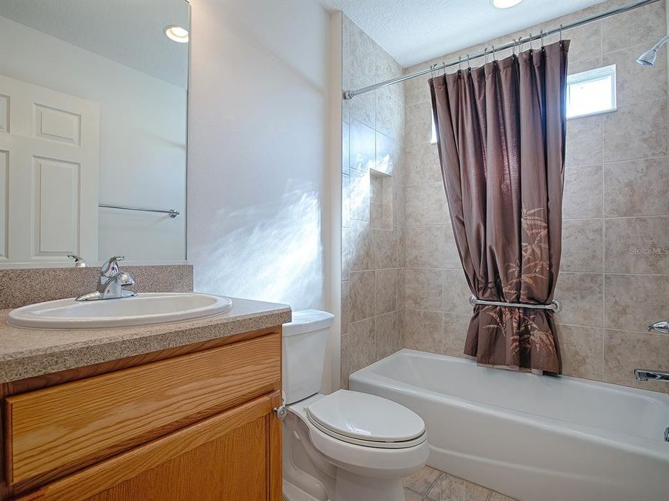 GUEST BATH WITH TUB/SHOWER.