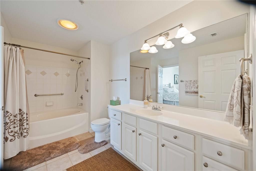 Bathroom with large vanity and garden tub