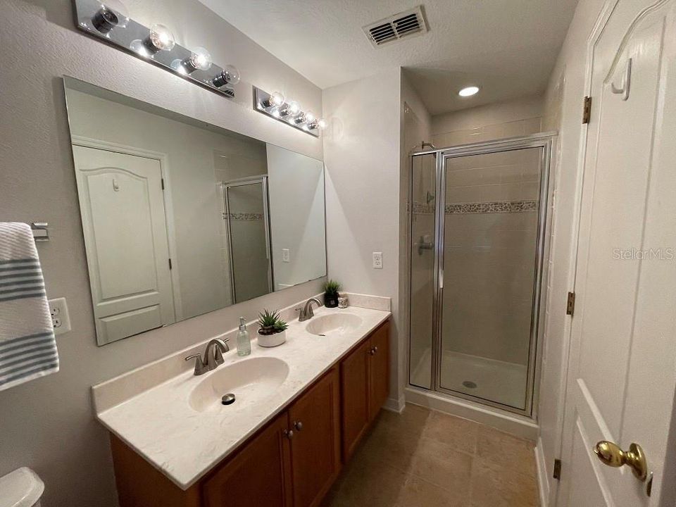 PRIMARY BATH WITH GLASS ENCLOSED SHOWER