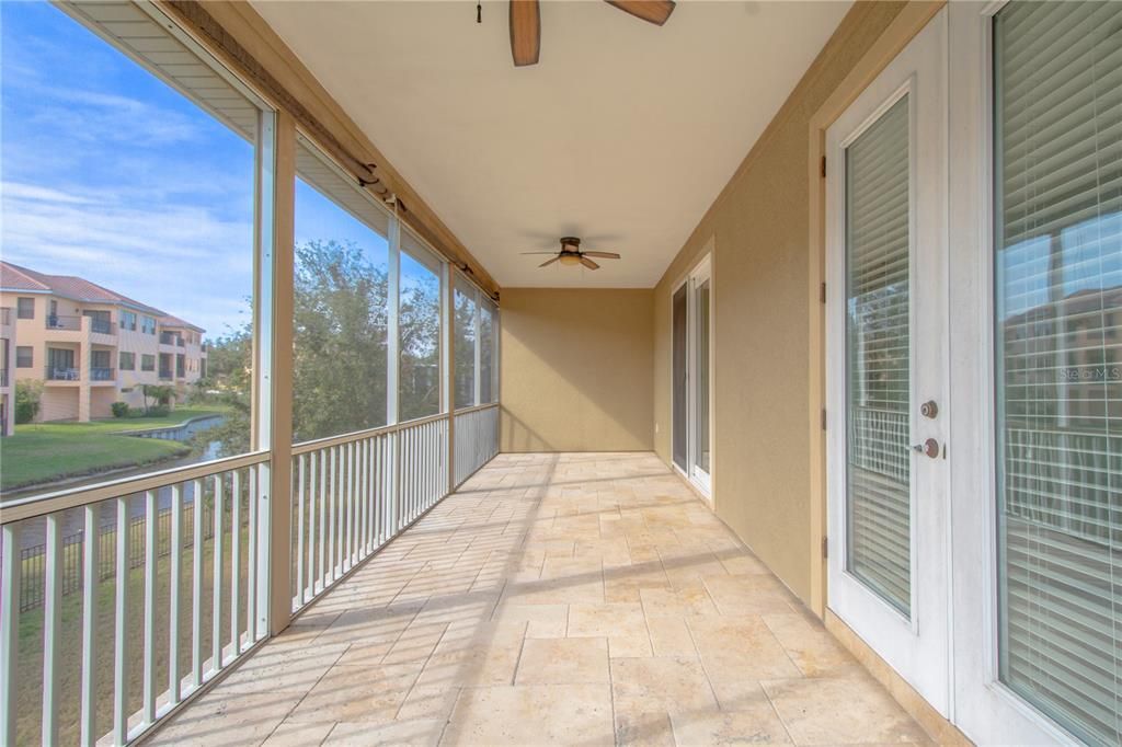 The primary bedroom also has access to the balcony through hurricane impact, French doors.