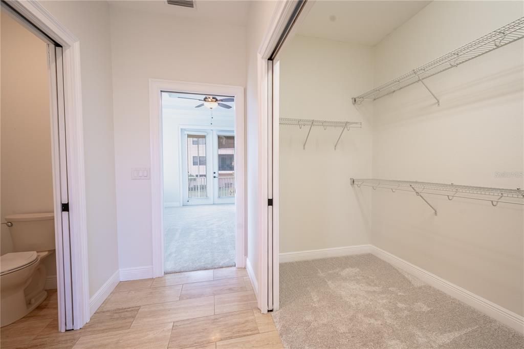 Primary ensuite walk-in closet and private water closet.