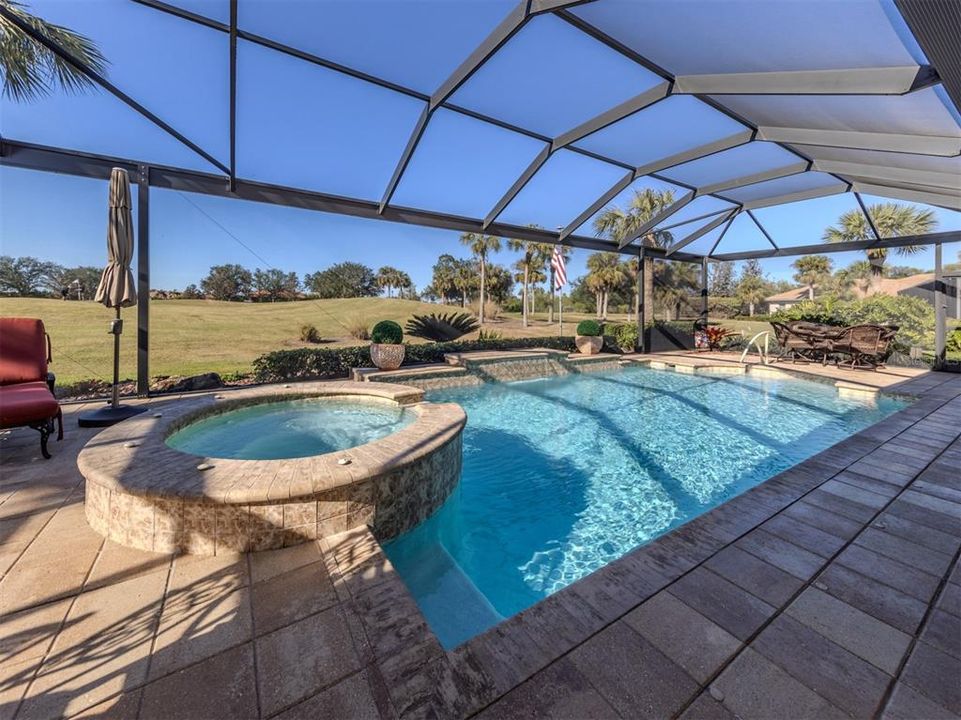 Inviting and new surface, tile and coping on  saltwater pool and spa.