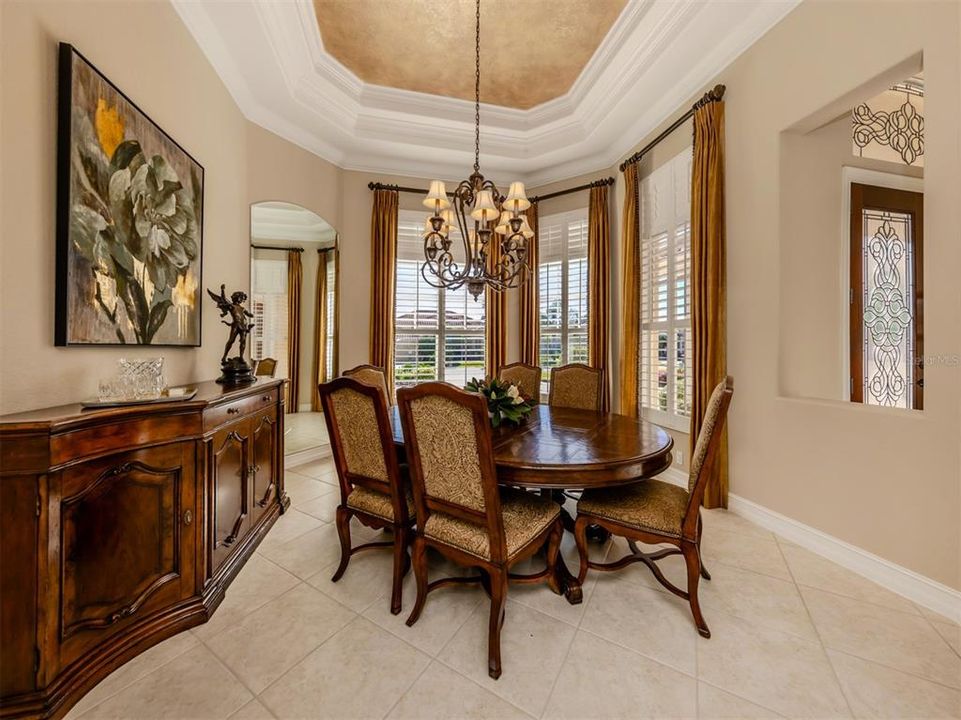 Exquisite dining room is adjacent to the kitchen creating a seamless flow for hosting formal dinner parties.