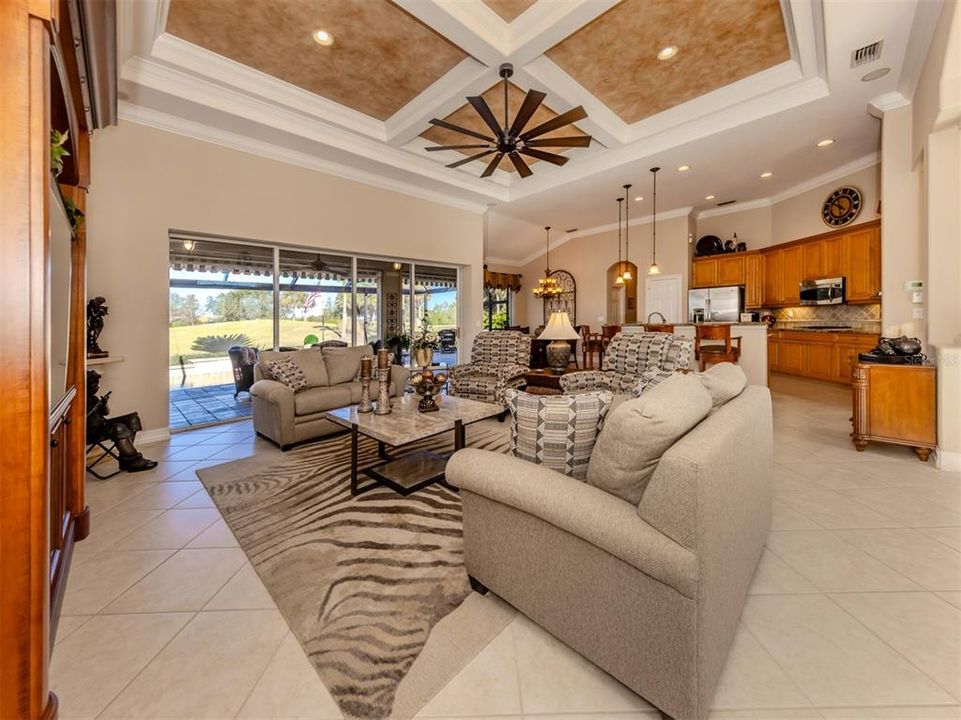 High coffered ceilings add sophistication to this elegant yet comfortable home.