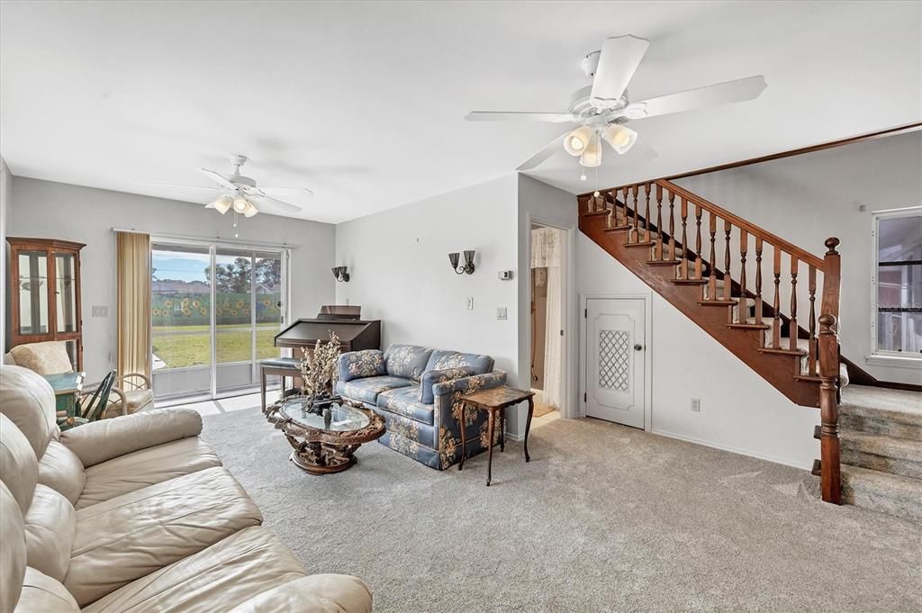 Living room and staircase up to the master suite.  Storage underneath the staircase.