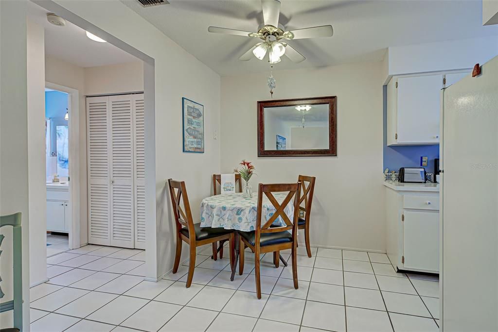 The dining area is conveniently located adjacent to the kitchen.