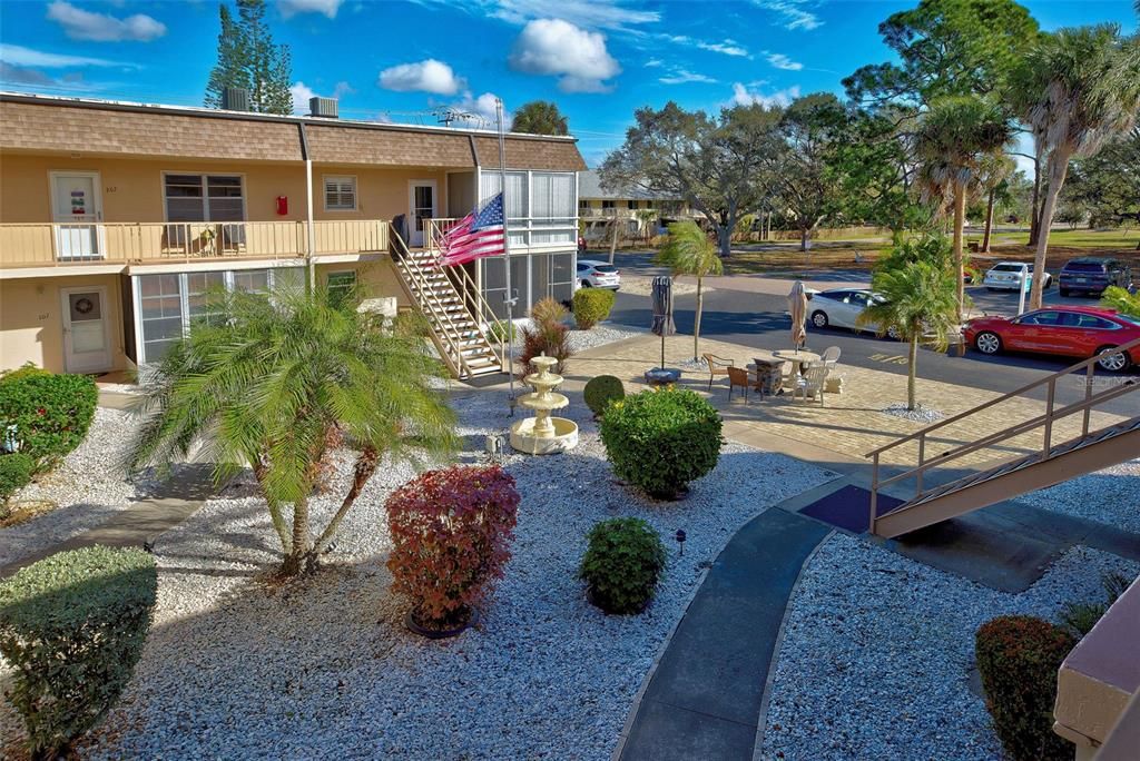 Enjoy the view of the courtyard and the park from your condo.