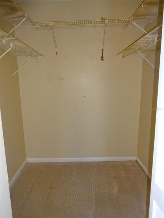 walk in closet in the primary bedroom