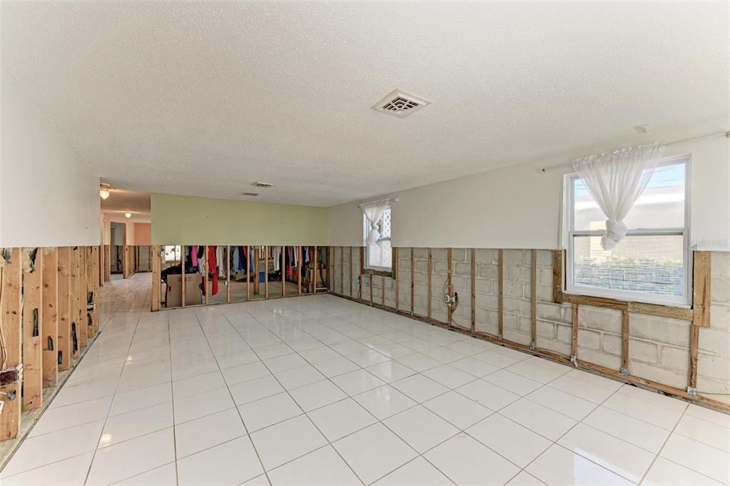 Large living area with ceramic tile