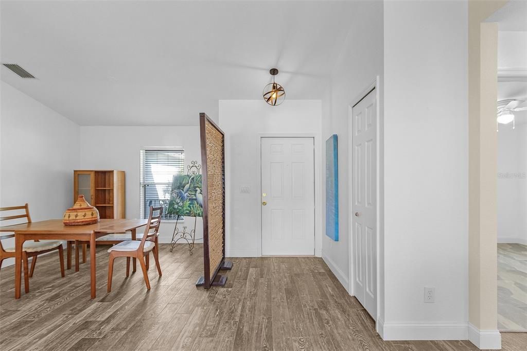 Dining area with ceiling fan and hardwood / wood-style floors