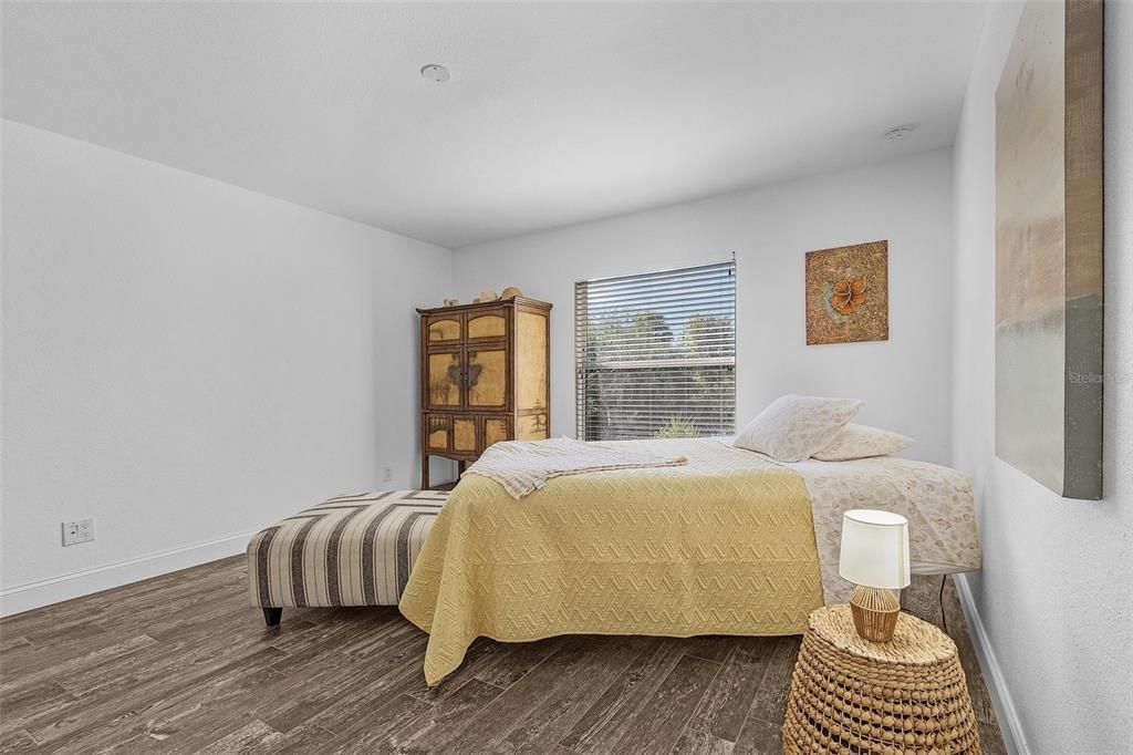 Bedroom featuring dark hardwood / wood-style floors