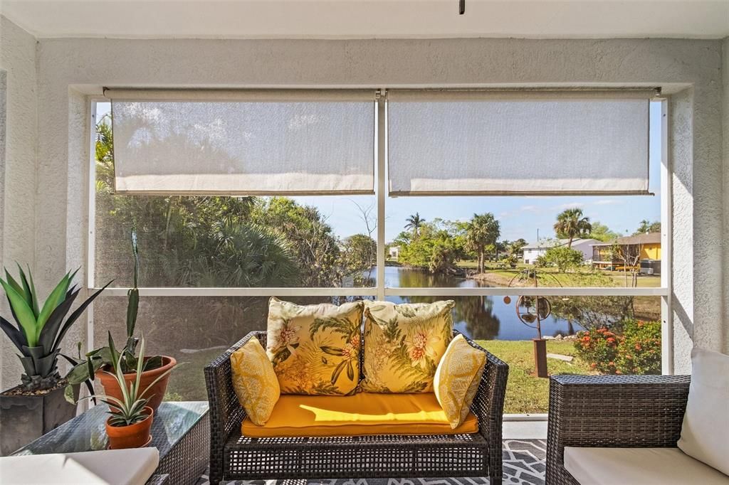 Sunroom / solarium featuring a healthy amount of sunlight and a water view