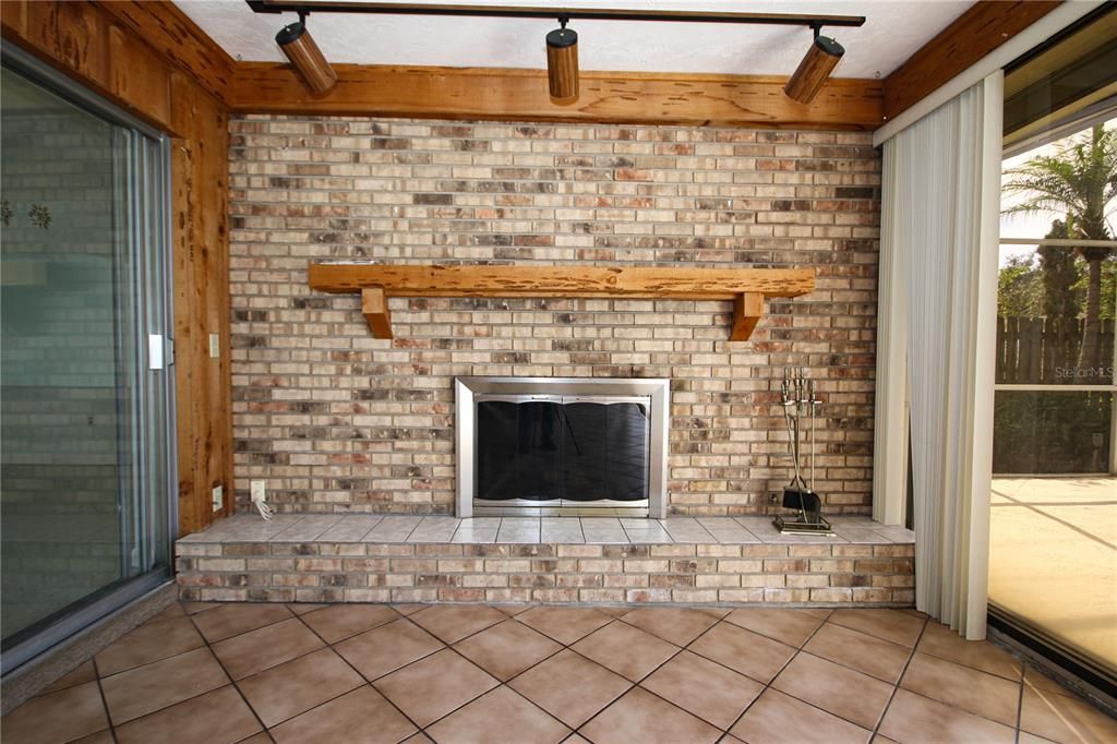 Wood Burning Fireplace in Sunroom off Living Room