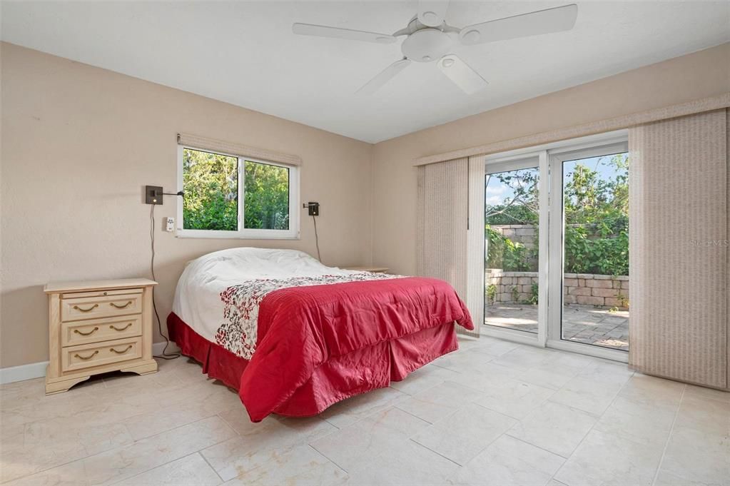 Primary bedroom with slider to patio