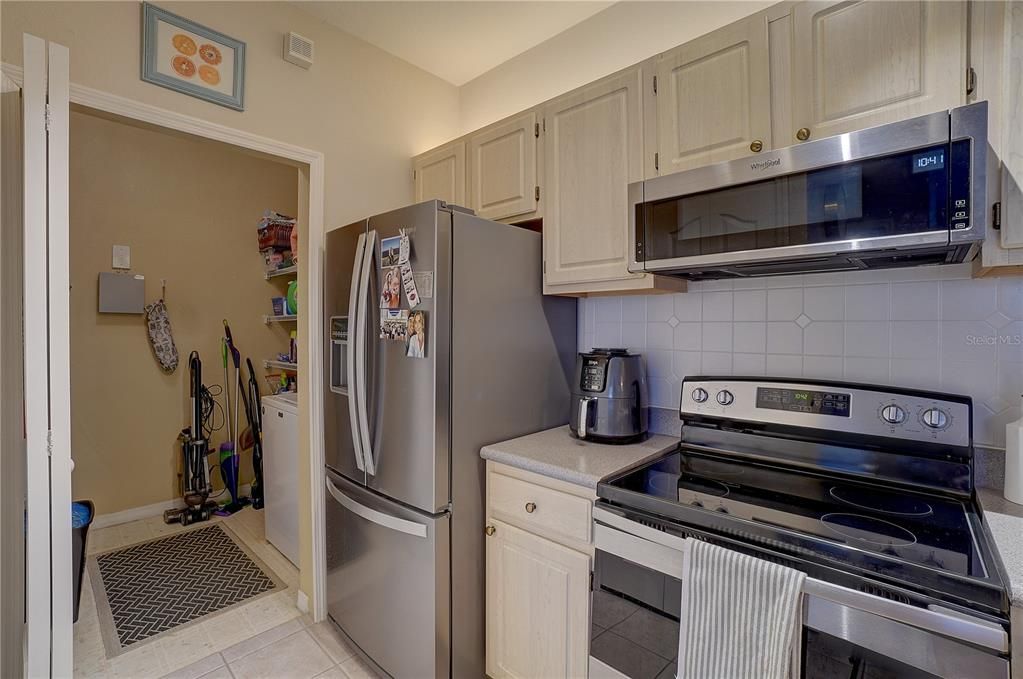 View of laundry room from kitchen