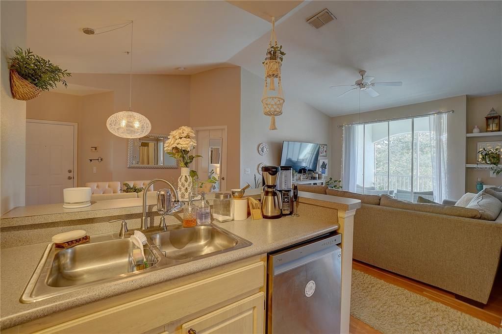 View of dining room and living room from kitchen