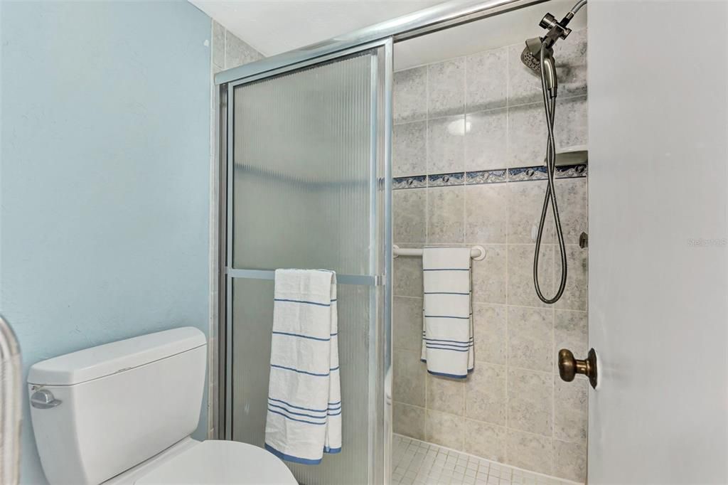 PRIMARY BATHROOM WITH TILED STALL SHOWER