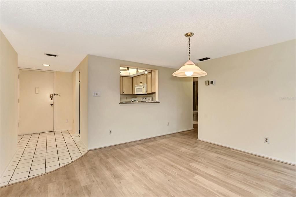 DINING AREA LOOKING TOWARDS FOYER/ENTRANCE