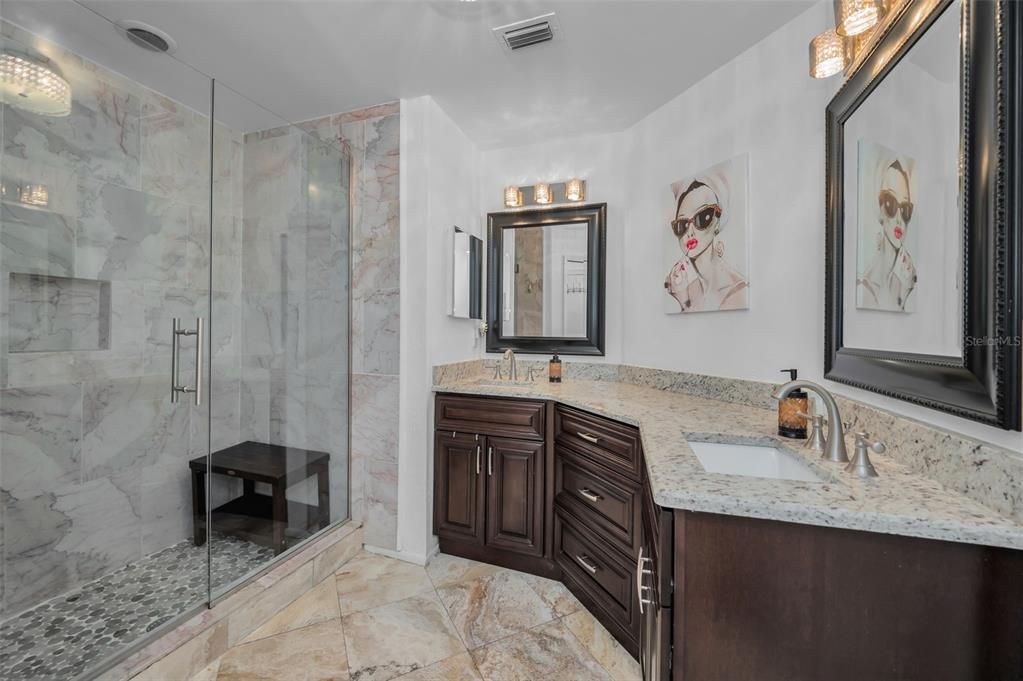 Primary bathroom with granite and double sinks