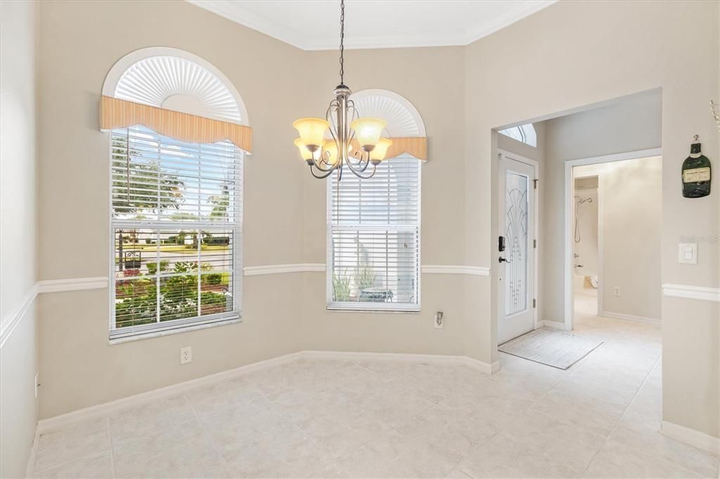 Kitchen nook area. Lovely windows.