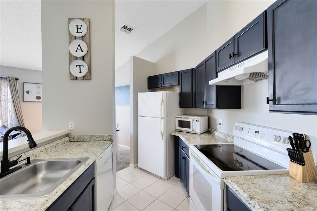 spacious kitchen that flows seamlessly into the living and dining areas, all with serene water views.