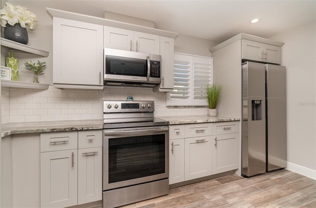 stainless appliances and tile splash