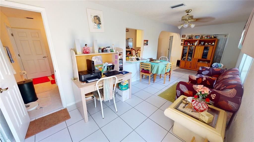 Tiled family room with entry to bathroom