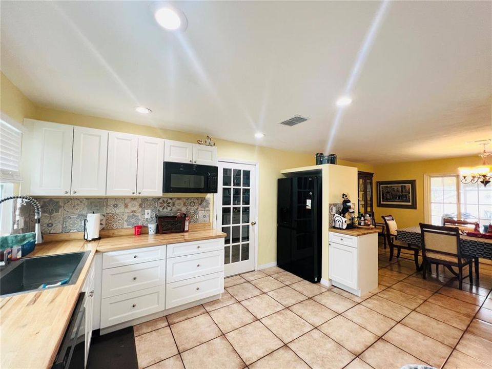 VIEW FROM BREAKFAST AREA OF KITCHEN WITH VIEW OF DINING AREA