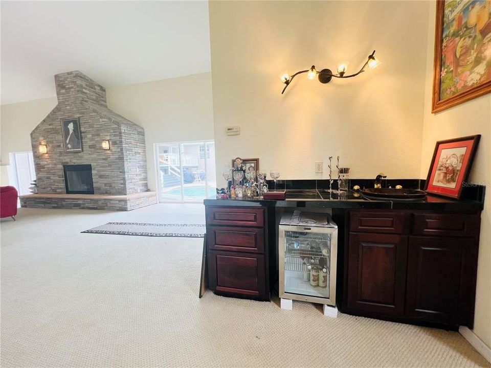 VIEW OF WET BAR AND FIRE PLACE