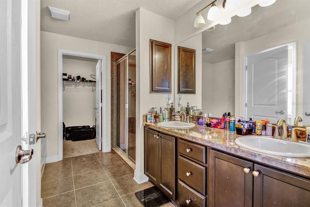 Primary Bathroom Dual Sinks--Walk-In Closet