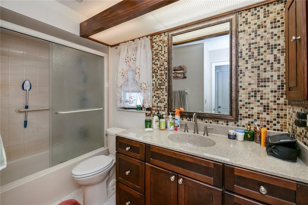 remodeled guest bath with tub/shower