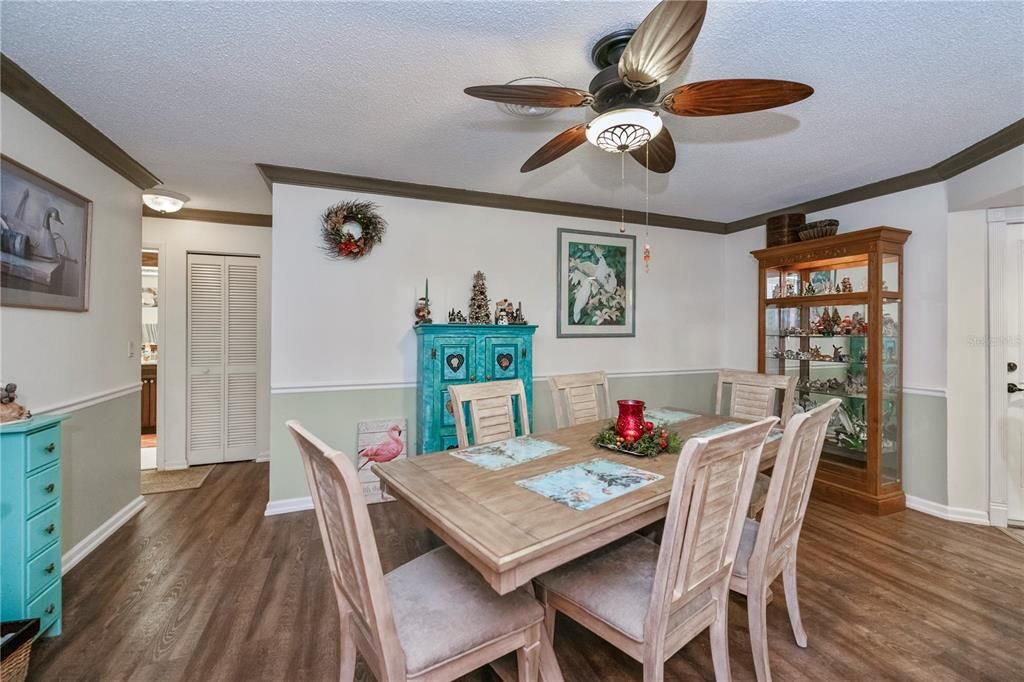 dining room with chair rail and crown molding