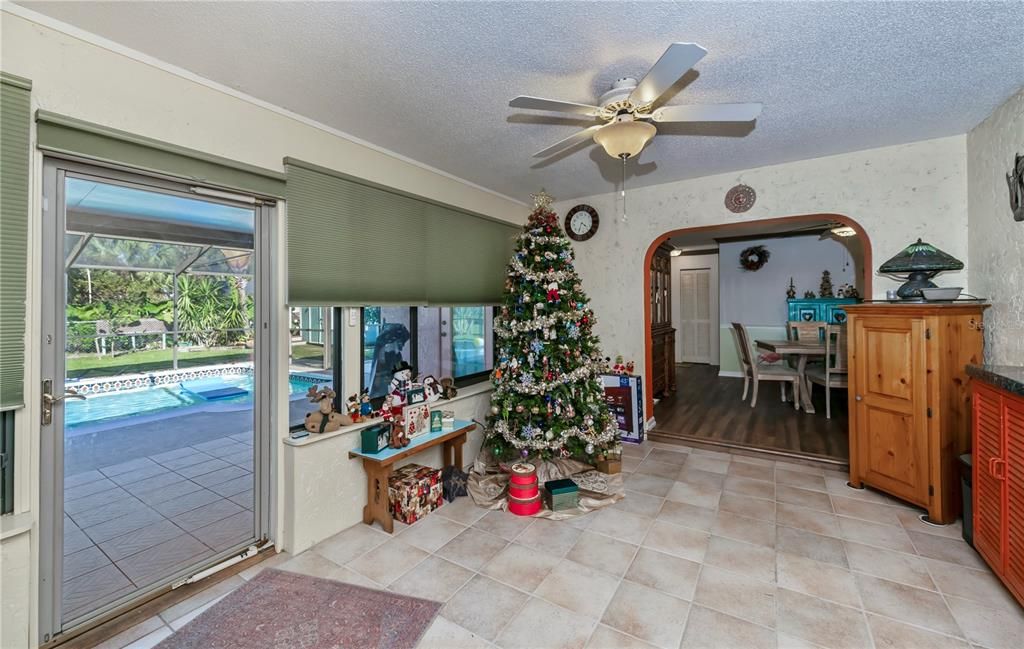 Family room opens to the spacious, enclosed lanai and fabulous backyard.