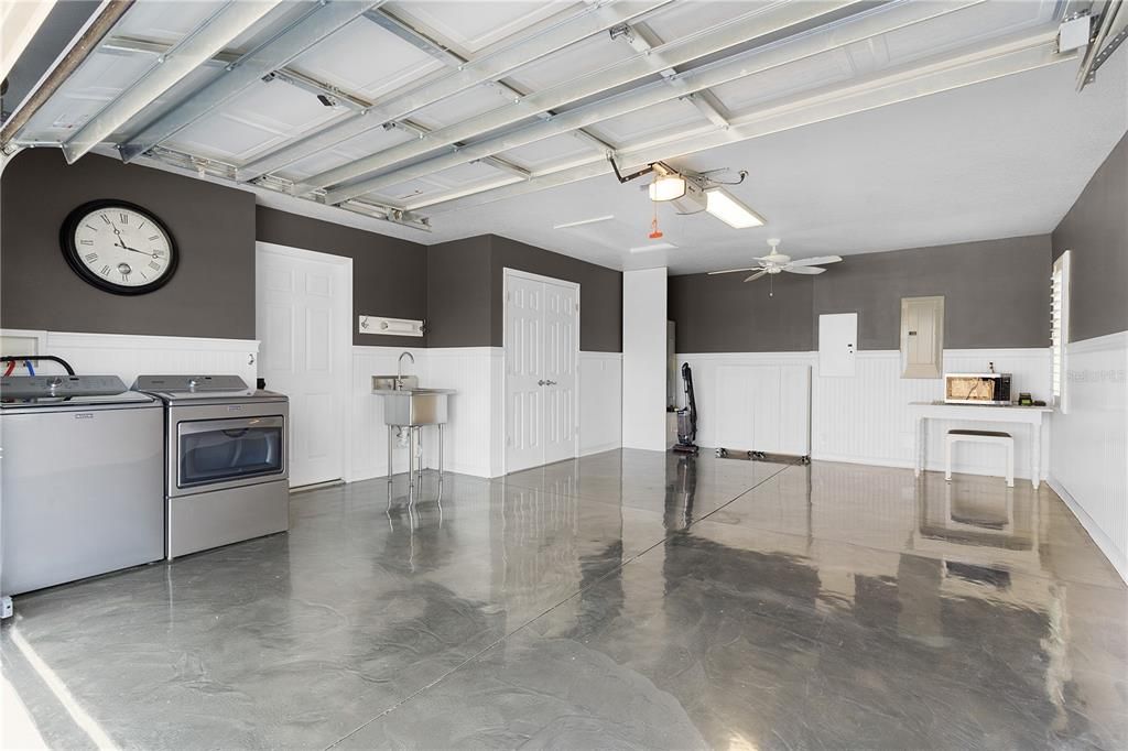 AN AMAZING 1 -1/2 CAR GARAGE WITH ROCK-SOLID FLOORING BY RUSTOLEUM, WAINSCOTING, EVEN PLANTATION SHUTTERS, AND MORE!