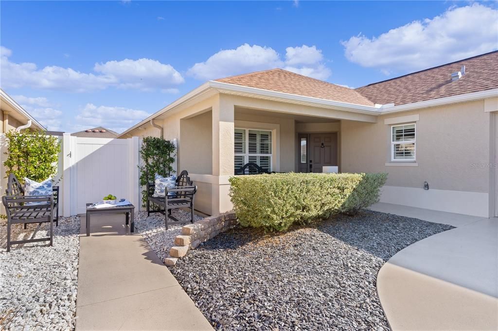 COVERED SPACIOUS FRONT PORCH OR PERHAPS A PLEASANT DAY IN THE SUNSHINE.