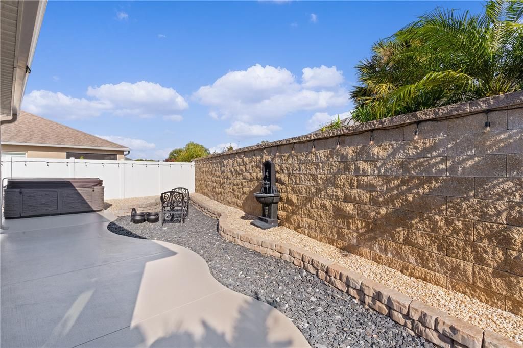 BACK OUTSIDE IN THE COURTYARD, YOU'LL FIND AN 8 PERSON HOT TUB AND CAFE LIGHTING.