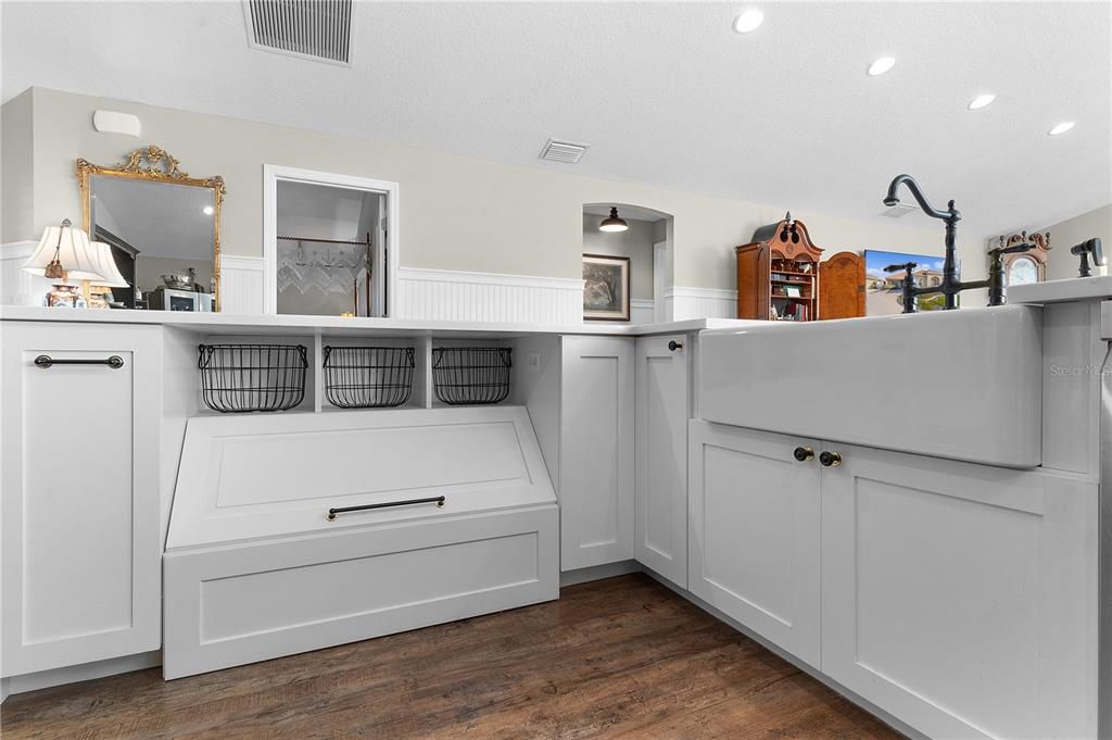 UNIQUE STORAGE FEATURES THROUGHOUT THE HOME AND A FARMHOUSE SINK.