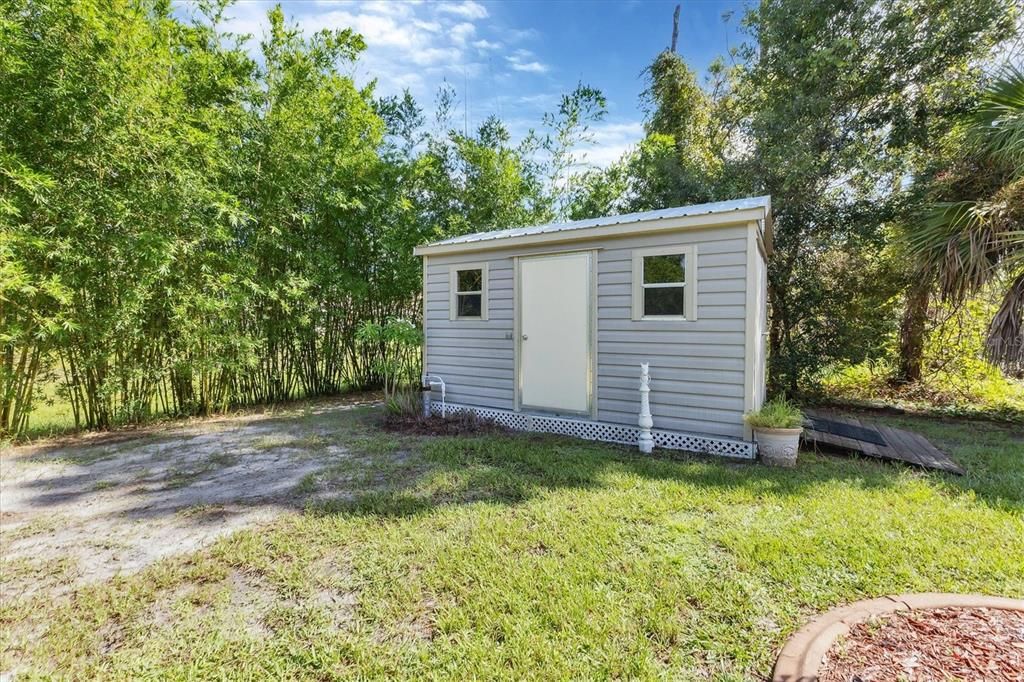 Storage shed with ramp access