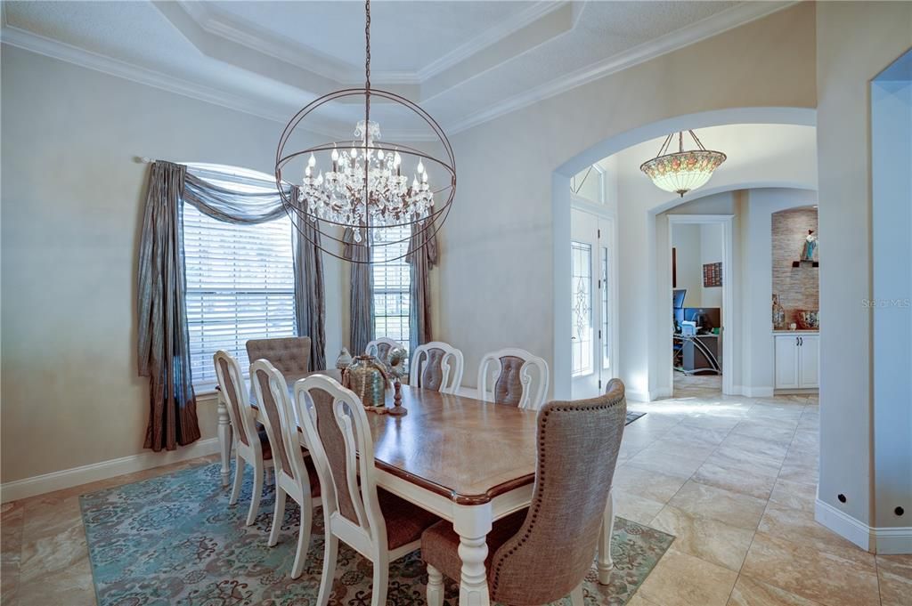 Enjoy dinner with family and friends in light and airy dining room.