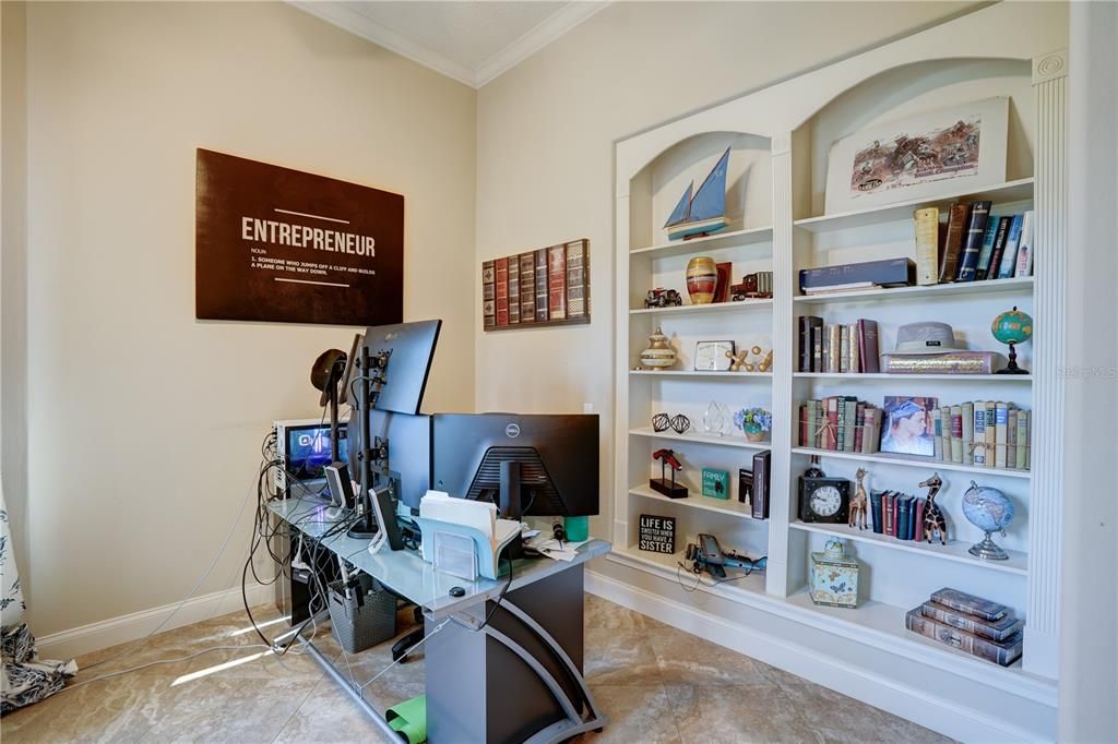 Private office with windows overlooking the manicured front yard & fountain