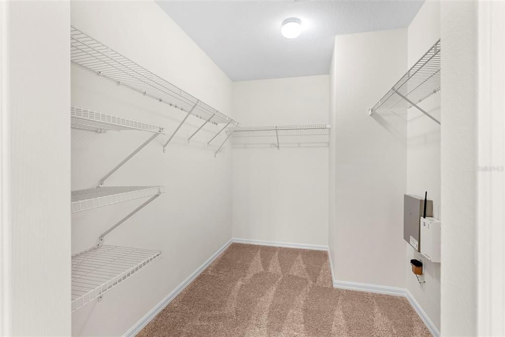 Large walk-in closet in master bedroom