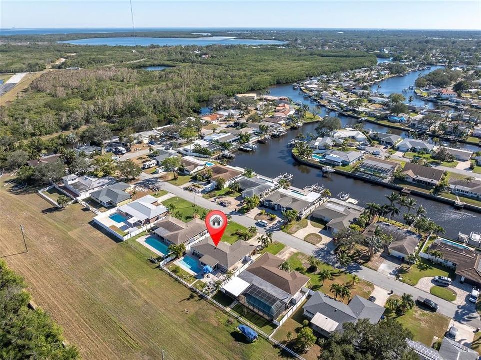 Field behind this house belongs to Power Co - it has a gated entry and you will have access to park a boat trailer or RV behind your home if you wish.